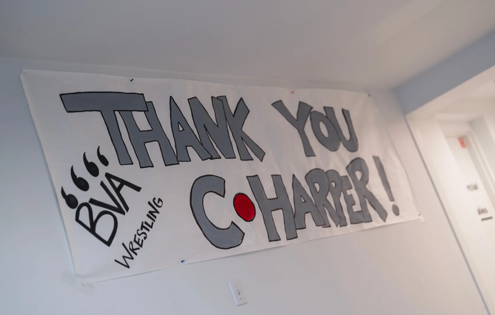 BVA Wrestling poster hanging up in C. Harper dealership that says: "Thank You C. Harper!"