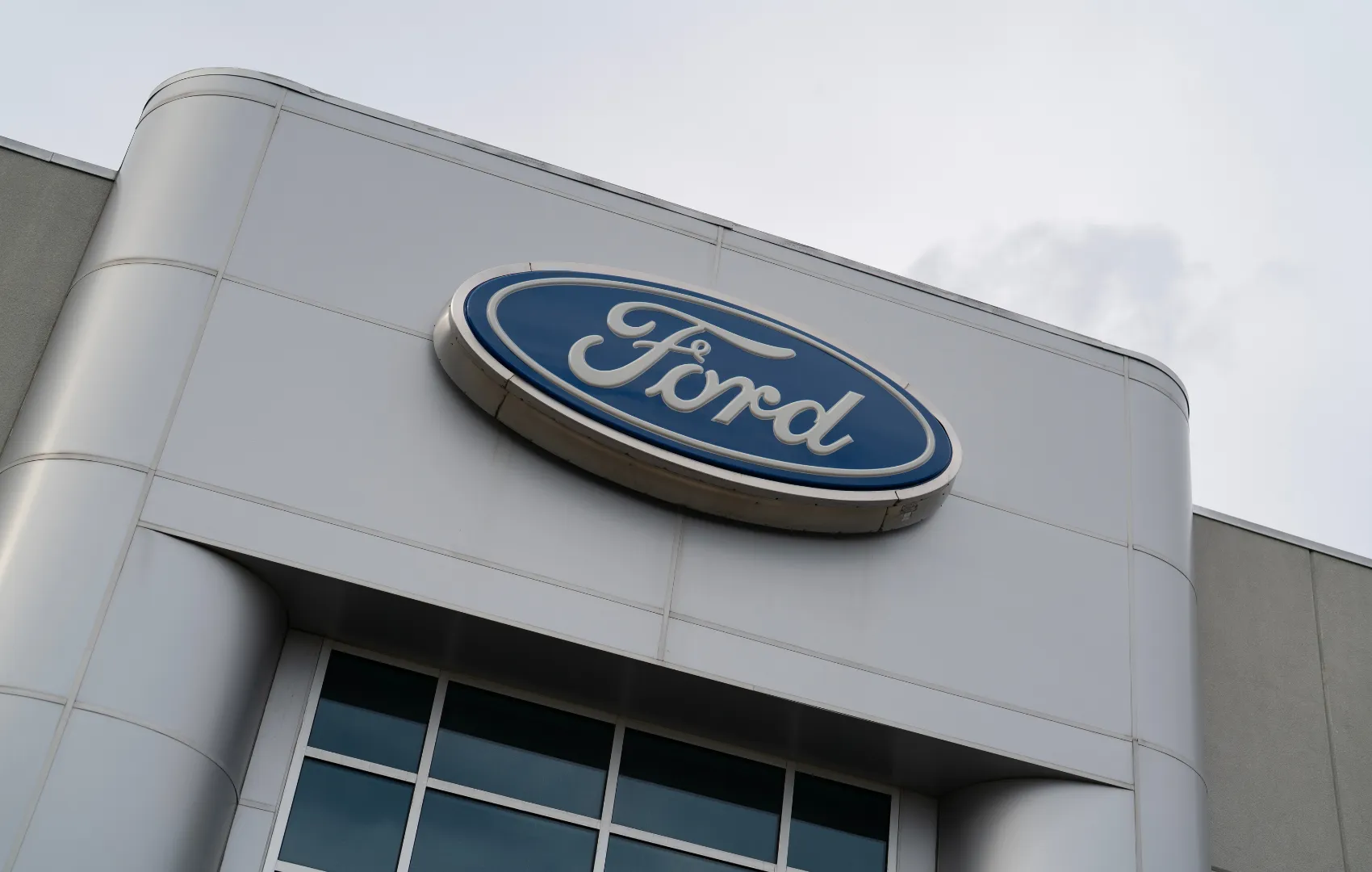 C. Harper Ford dealership building and logo