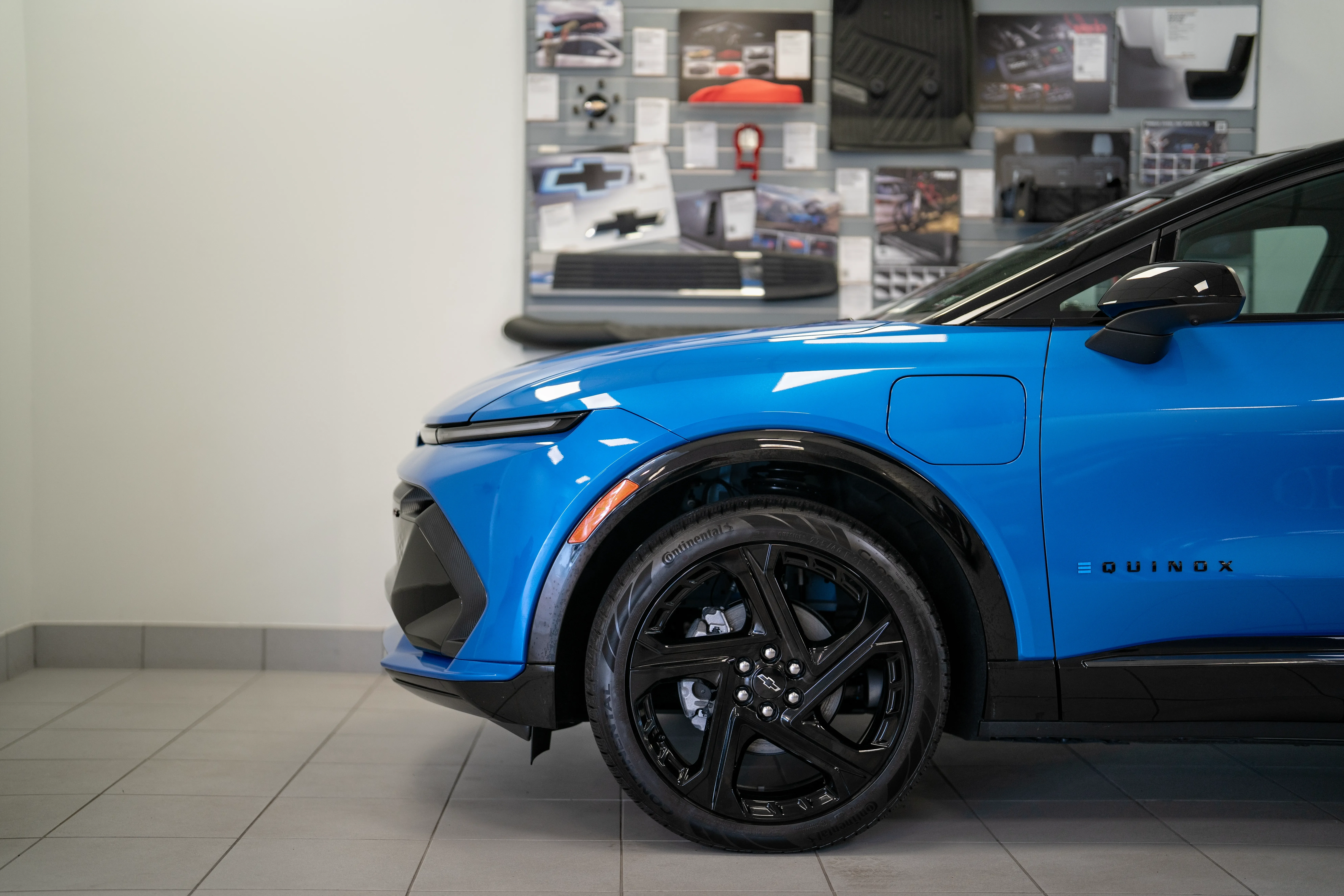 Blue chevy sitting inside C. Harper Chevy dealership